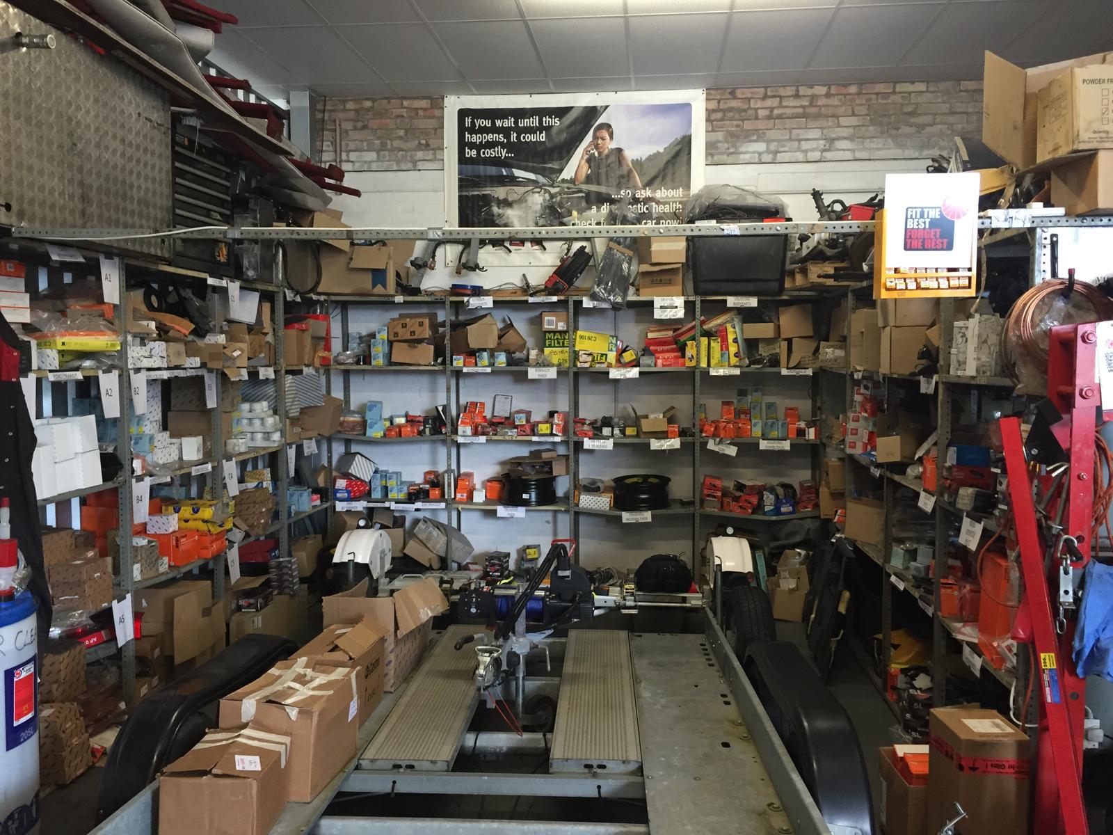 Fully stocked garage storage with parts and tools ready for fleet servicing
